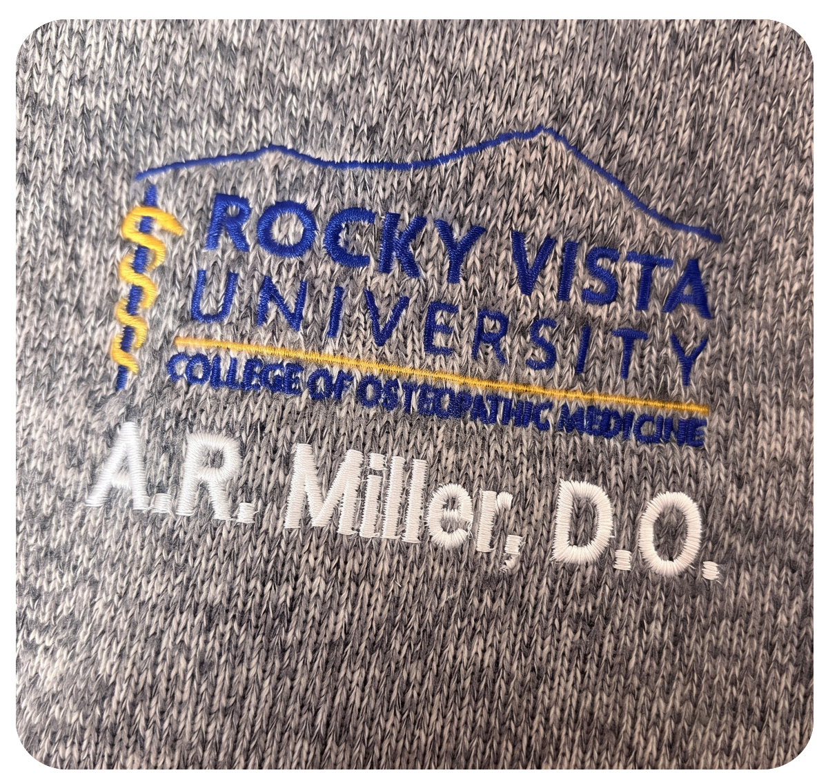 Custom apparel with an embroidered individual name beside the logo