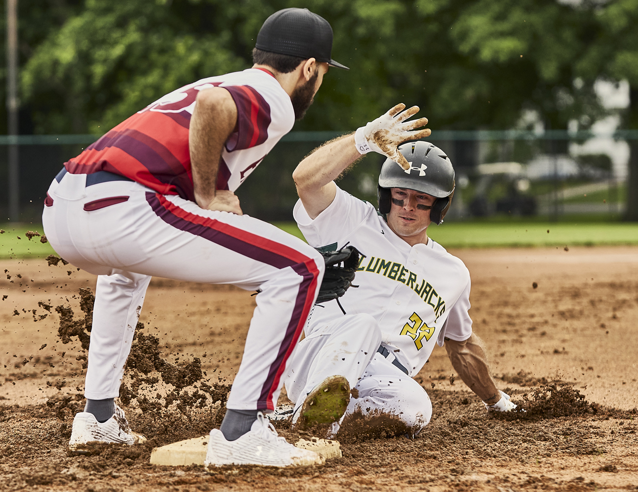 Players wearing custom Under Armour baseball jerseys with professional numbering and logos
